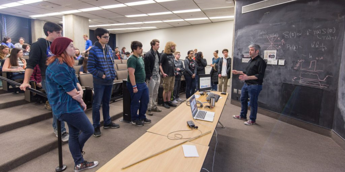 Dan Hooper giving a lecture to participants of Fermilab's Saturday Morning Physics Program