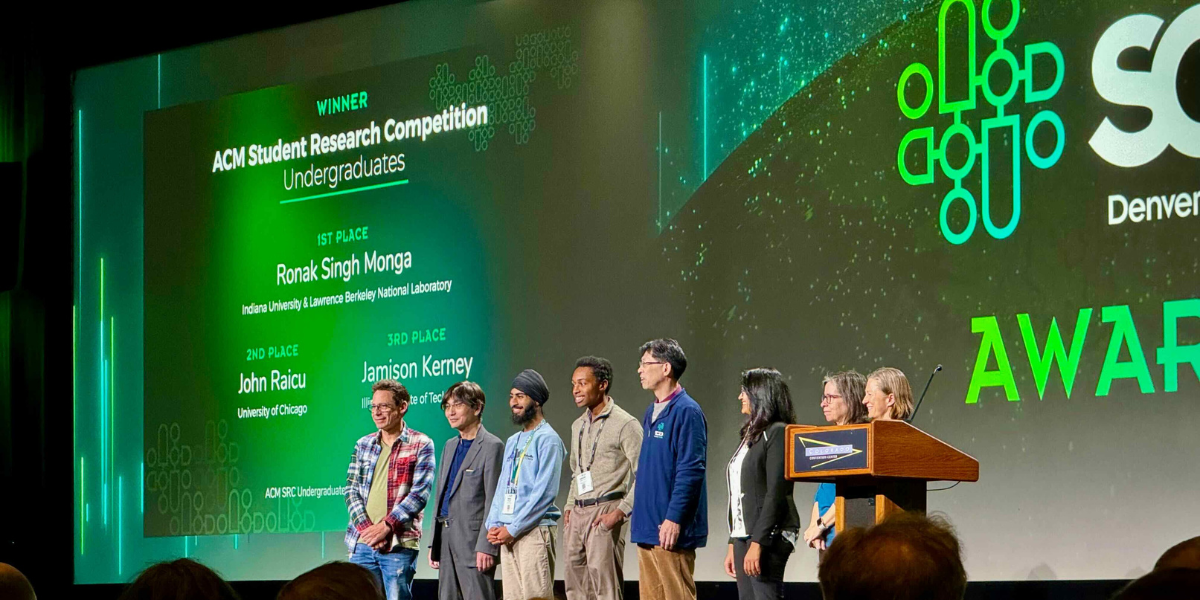 A photo of Jamison on stage at SC23 for winning 3rd place in the ACM Undergraduate Student Research Competition.